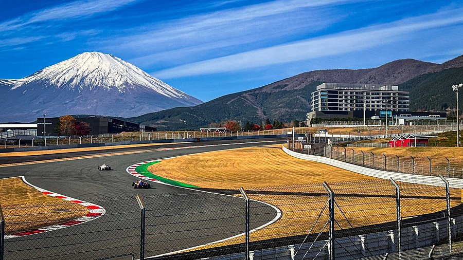 Fuji Speedway with snow-capped Mount Fuji in the background.